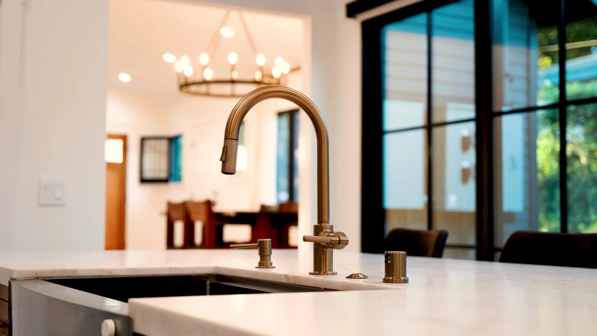 Warm stone and brass details in a residential bathroom